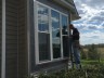 Workers make windows for home roofing window slider