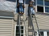 Workers make windows for home roofing window slider