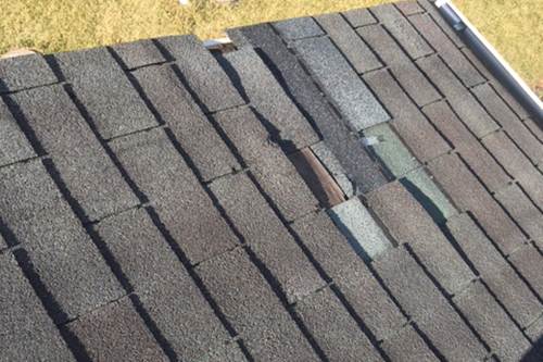High Wind Damage to Shingles in Carroll County