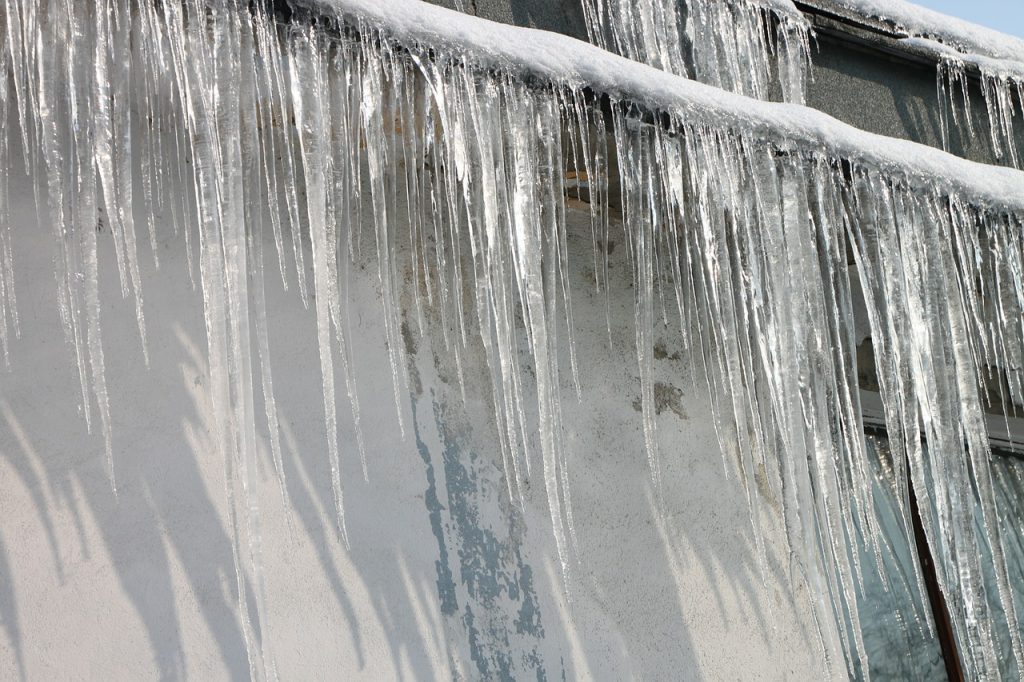 A row of icicles on a roof 