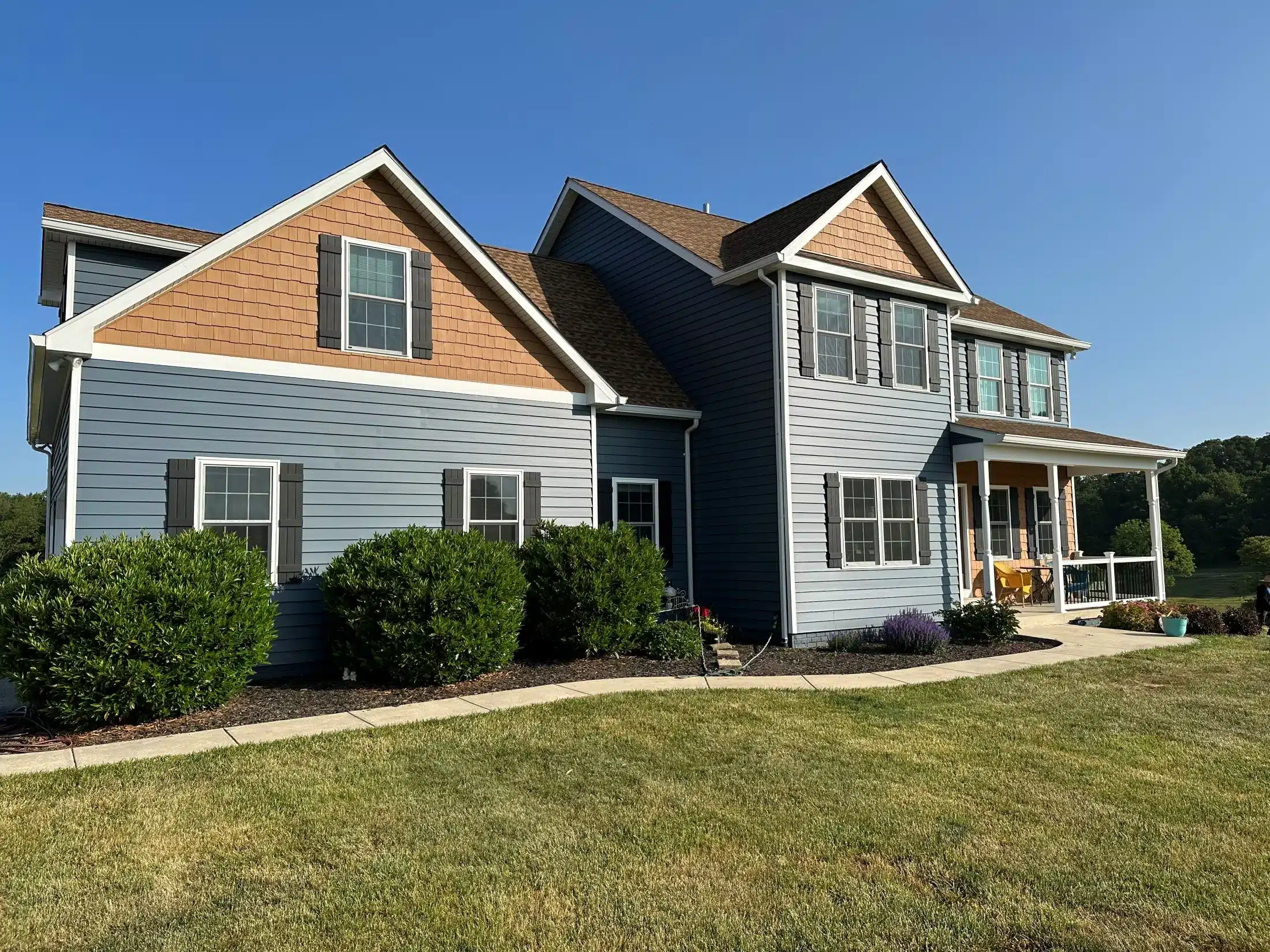 platinum exteriors blue home front view jpg